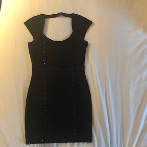 Guess black bandage dress, keyhole back with sequin detail. Size small.